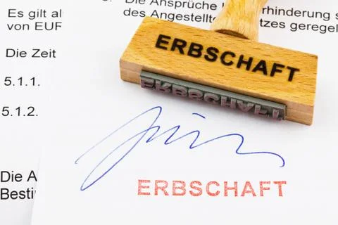 Wood stamp on the document: inheritance Stock Photos