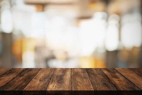 Wood table with blur interior coffee shop or cafe for background. Stock Photos