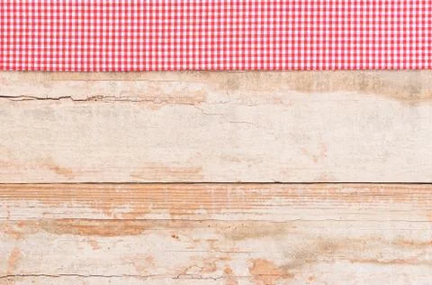 Wood table top background texture, with rustic red tablecloth Stock Photos
