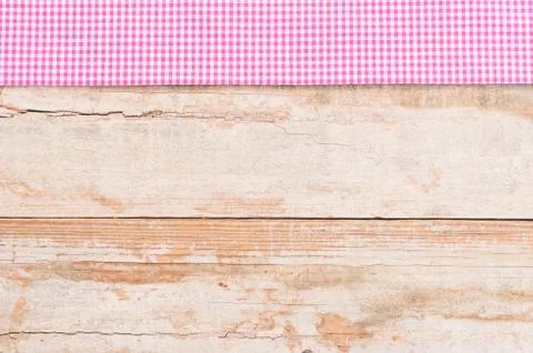 Wood table top background texture, with rustic pink tablecloth Stock Photos