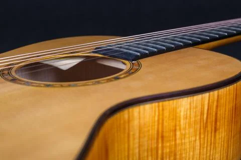 Wood texture of lower deck of six strings acoustic guitar on black background Foto stock