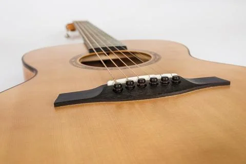 Wood texture of lower deck of six strings acoustic guitar on white backgrou.. 스톡 사진