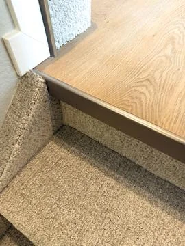 Wood Threshold Between Carpet And Flooring Detail Stock Photos