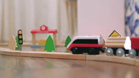 Wood toy electrical train pulls cars Stock Footage 143139183