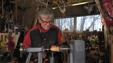 Wood turner cutting shapes in wood Stock-Footage 59336780