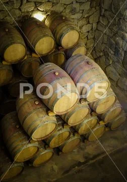Wood wine barrels in a winery Stock Photos
