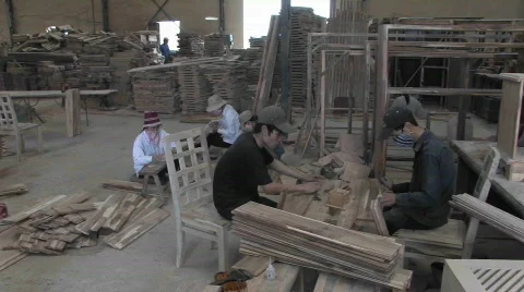 Wood workers hard at work crafting hand made furniture. Stock Footage
