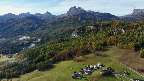 Wooded area that borders large valleys where houses and villas can be seen. Stock Footage 221187706
