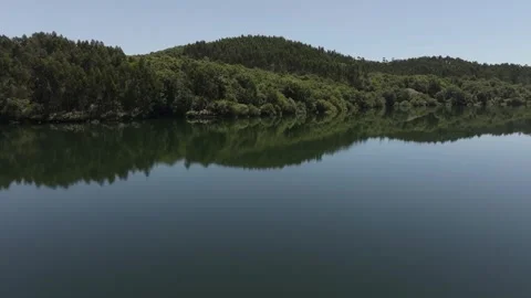 Wooded Mountains With Reflections Over Idyllic Lake Near Vídeos de archivo 280836744