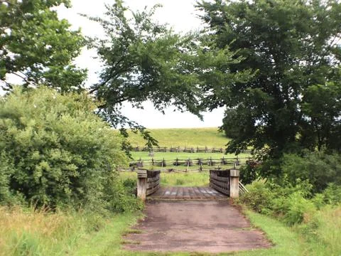 Woodedn bridge leading into meadow (2) Stock Photos