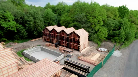 Wooden accommodation complex and swimming pool in building process Stock Footage 345896133