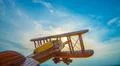 The wooden airplane on the background of the sunset Photo