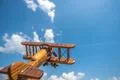 The wooden airplane fly on the cloud background Photo