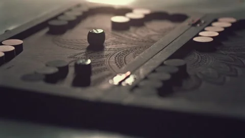 Wooden backgammon board and dice rolling in slow motion, traditional board game Stock Footage 303522012