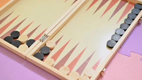 Wooden backgammon board game with black and white pieces Stock Footage 290052766