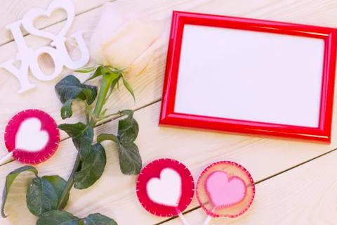 Wooden background with a cream rose Stock Photos