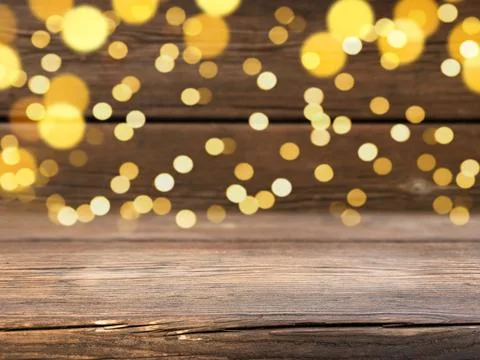 Wooden background with defocused lights. Empty surface for displaying products Stock Photos
