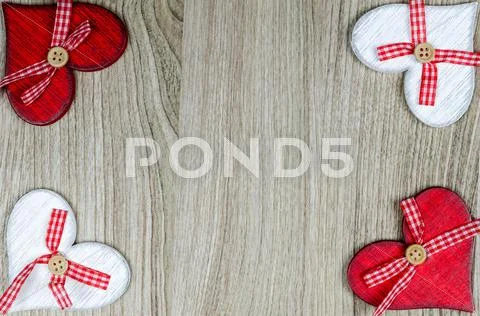 Wooden background with red and white hearts Stock Photos