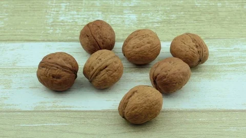 On a wooden background walnuts Stock Footage 80335669