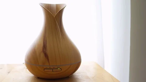 Wooden bamboo essential oil diffuser closeup, with buttons timer, steam Stock Footage 92762709