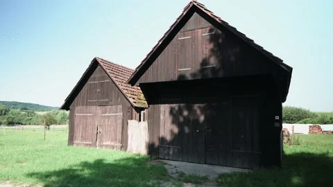 Wooden barn in a field Stock Footage 141468290