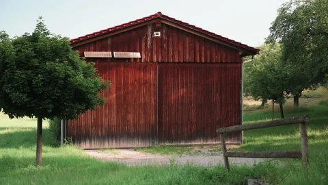Wooden barn in a field Stock Footage 141468810