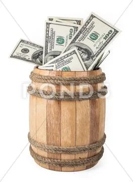 Wooden barrel with hundred dollar bills Stock Photos