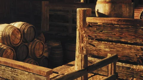 Wooden barrels and a structure inside an old barn in daylight Stock Footage 342043693