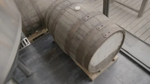 Wooden Barrels Resting on Pallets Inside Brewery in Beijing, China Stock Footage 345756249