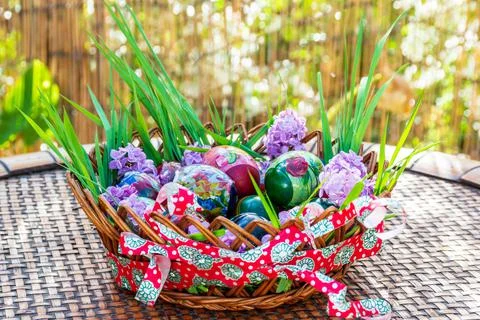 Wooden basket easter decoration with easter eggs Stock Photos