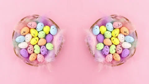 Wooden baskets with Easter eggs rotating on pastel pink theme. Stop motion Stock Footage 148789385