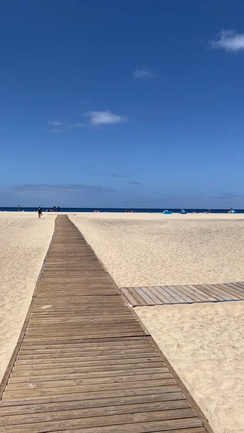Wooden beach path to cabin ocean view pan Morro Jable Fuerteventura HD vertical Vídeo Stock 342038710