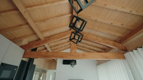 Wooden beam ceiling with hanging cube pendant lights Stock Footage 337913792