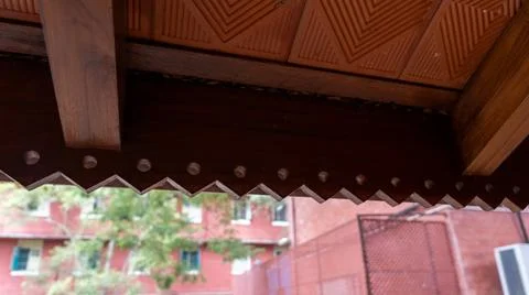 A wooden beam with a pattern of triangles on it. in Chennai Stock Photos
