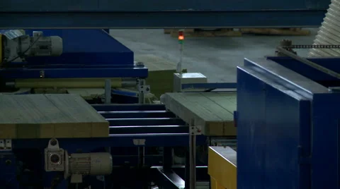 Wooden beams moving at machine in workshop Stock Footage 56834022