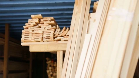 Wooden beams stacked on a rack inside a shipping container. Side view, zoom in, Stock Footage 82373111