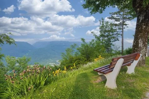 Wooden bench with a mountain view. Stock Photos