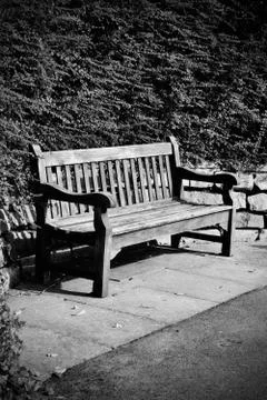 Wooden bench in park Stock Photos