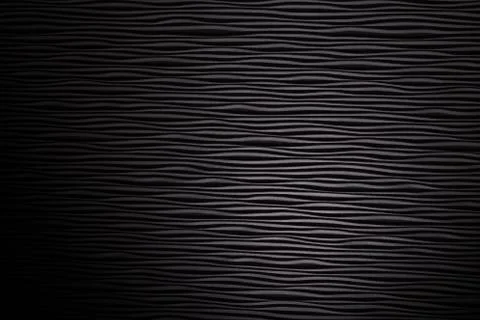 Wooden black undulating surface texture. Stock Photos