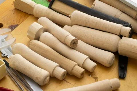 Wooden blanks to replace the handles of tools .a lot of details in on the table Stock Photos
