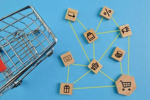 Wooden block with E-commerce concept. Online shopping, delivery and payment m Stock Photos
