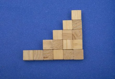 Wooden Blocks creating a progress bar upwards business concept Stock Photos