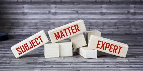 On wooden blocks the inscriptions SUBJECT, MATTER, EXPERT. Business concept Stock Photos