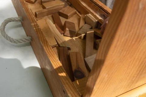 Wooden blocks inside a box on a table for game Stock Photos