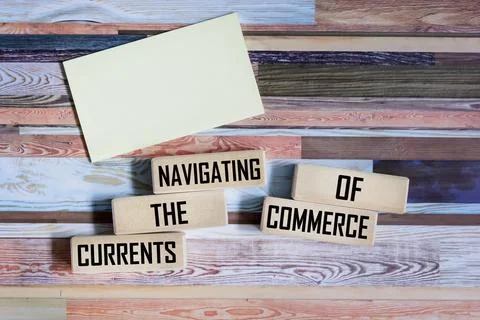Wooden blocks with the message Navigating the flow of trade on a vintage ba.. Stock Photos