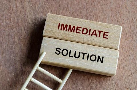 Wooden blocks representing an immediate solution to urgent problems and cha.. Stock Photos
