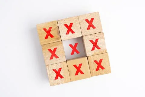 Wooden blocks show the wrong marks. concepts decisions, votes, and thinking.. Stock Photos