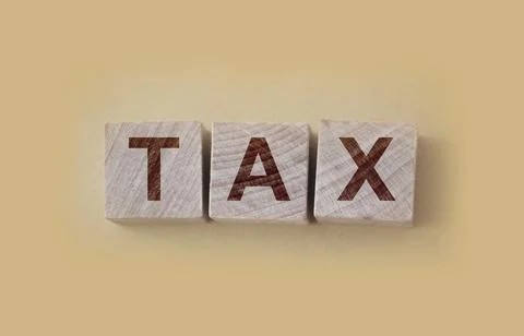 Wooden blocks with space for text on table, closeup. Tax concept Stock Photos