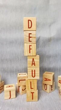 Wooden blocks spell "DEFAULT" in bold red letters Ilustración de archivo