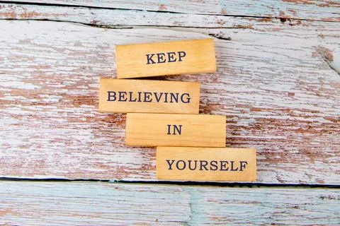 Wooden blocks stack together to form an uplifting message encouraging everyone Stock Photos